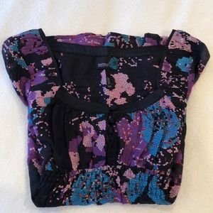 Cap sleeve blouse with bold floral pattern